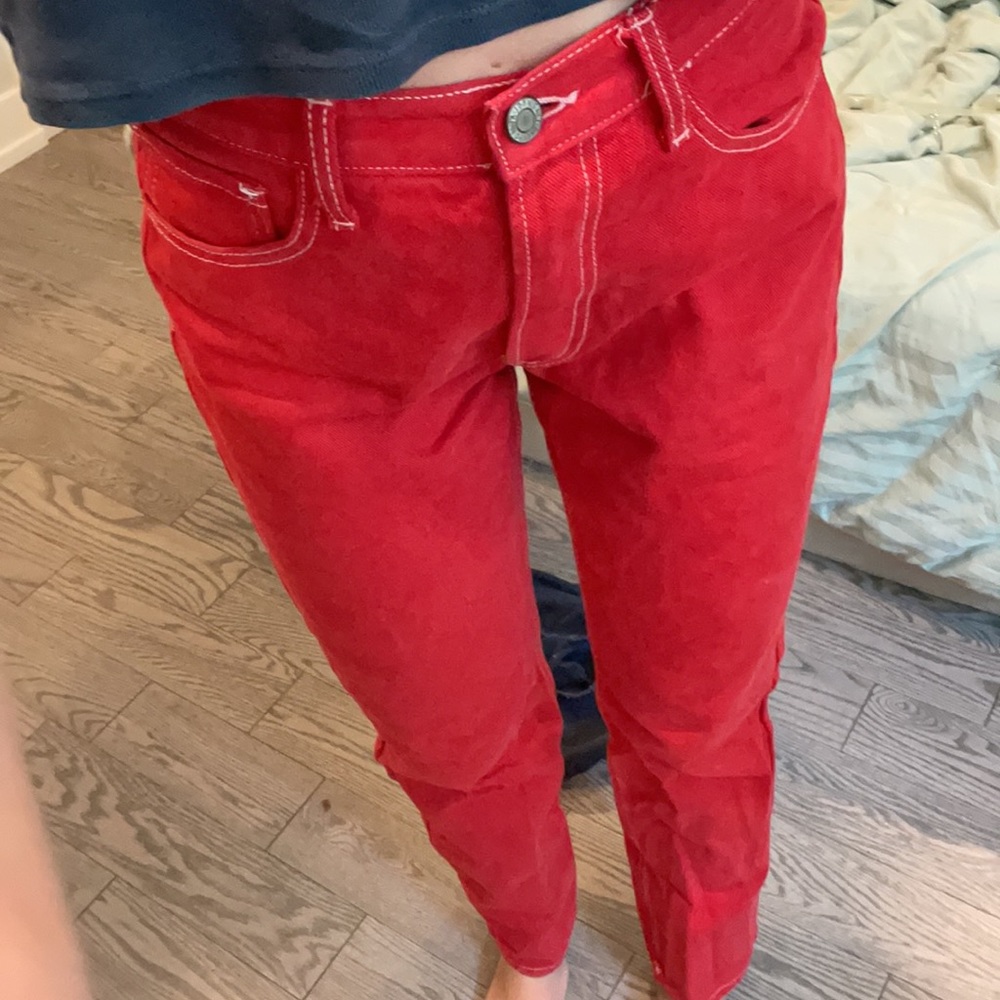 Red Brandy Melville jeans with white stitching